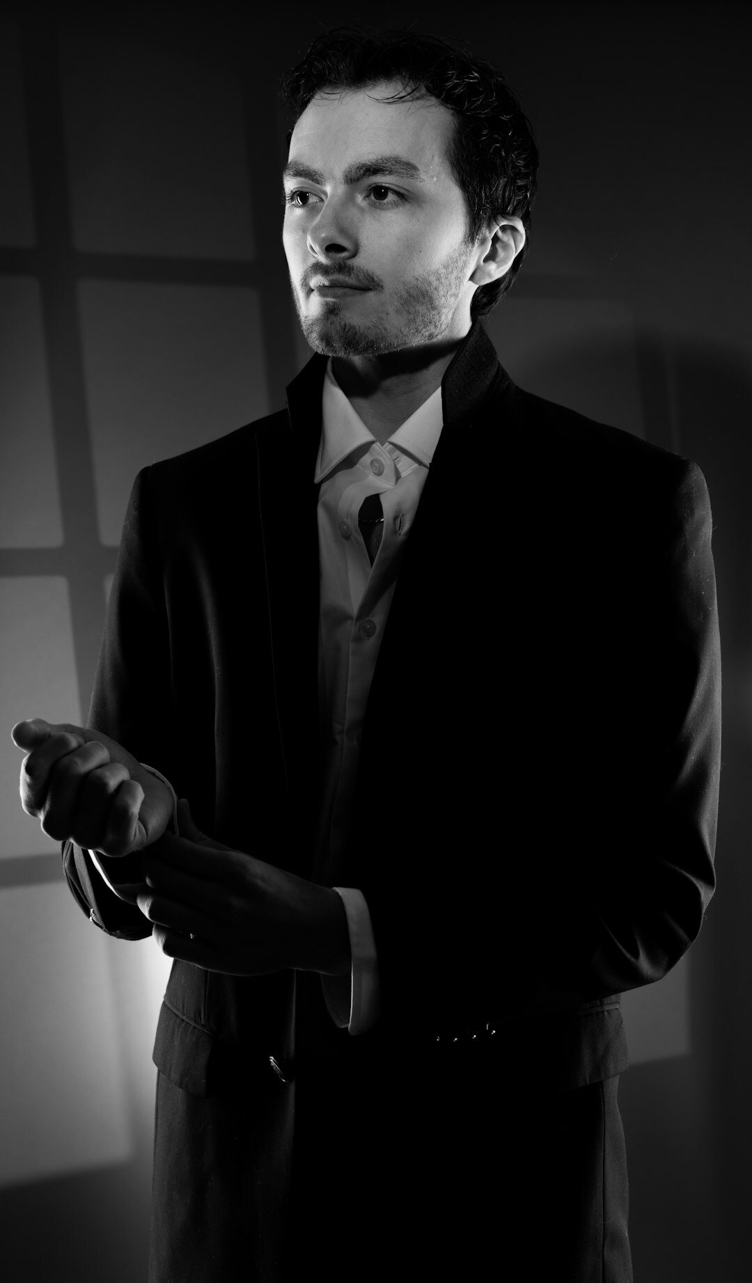 Studio portrait of a professional man lecturer in a suit